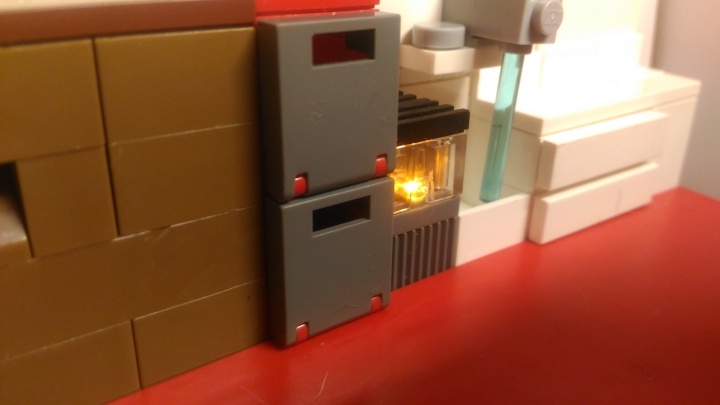 LEGO MOC - New Year's Brick 2017 - Новогодняя комната семьи: Плита загорается ораньжевым цветом.