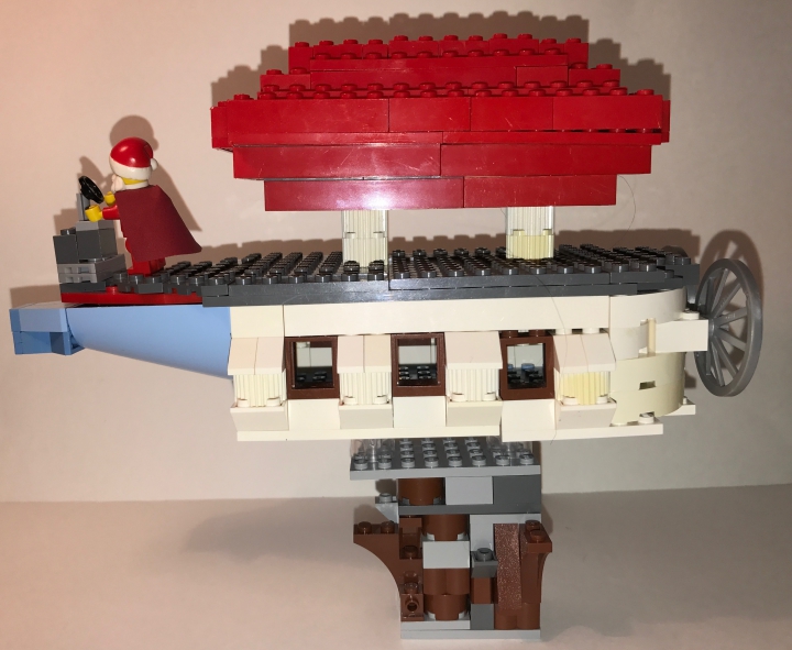 LEGO MOC - New Year's Brick 2017 - Новый год на планете великанов: Да, да и у великанов есть свой дед мороз  (правда доподлинно не известно как они его называют). Он перемещается на своем дирижабле между скалами и раздает подарки. Но кто он от рождения карлик или наш с вами сородич, этого никто не знает. Дед мороз облетает всю планету так же быстро, как и наш.